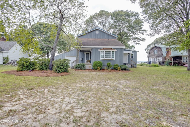 back of property featuring a lawn and a porch