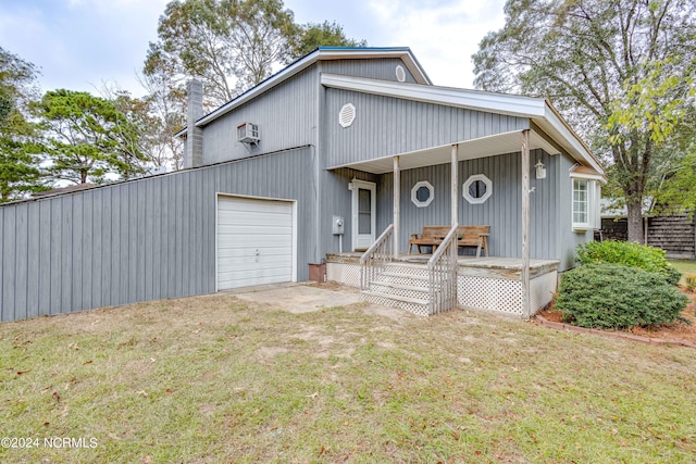 view of front facade with a front yard and a garage