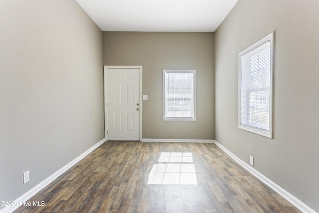 unfurnished room featuring dark hardwood / wood-style floors