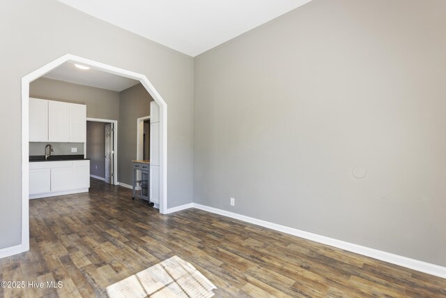 interior space featuring sink and dark hardwood / wood-style floors