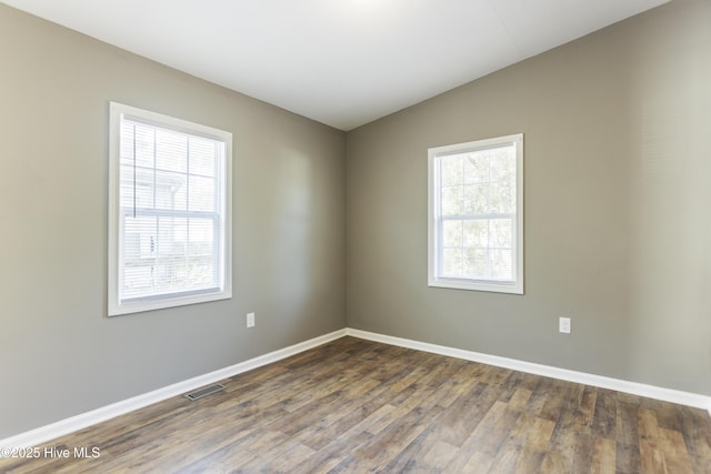 empty room featuring dark hardwood / wood-style floors