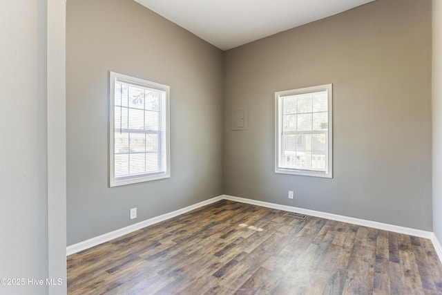 unfurnished room featuring dark hardwood / wood-style floors