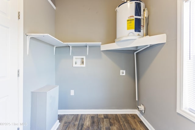 laundry area featuring water heater, hookup for a washing machine, dark hardwood / wood-style flooring, and hookup for an electric dryer