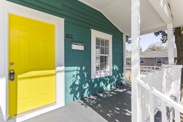 entrance to property featuring a porch