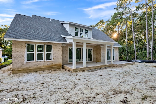 bonus room featuring vaulted ceiling and concrete flooring