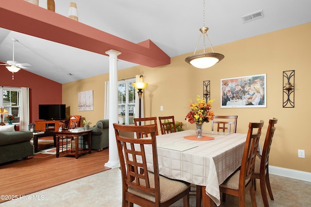 dining area featuring visible vents, decorative columns, baseboards, ceiling fan, and vaulted ceiling