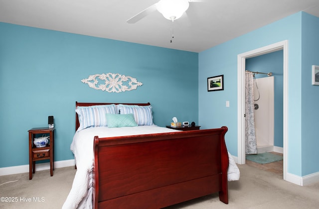 bedroom featuring ceiling fan, baseboards, and light carpet