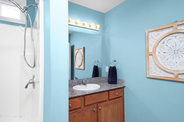 bathroom featuring vanity and walk in shower