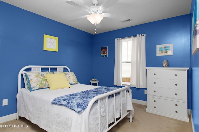 bedroom featuring visible vents, carpet flooring, a ceiling fan, and baseboards