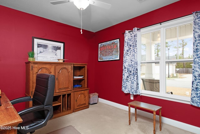 home office featuring baseboards, carpet floors, and ceiling fan