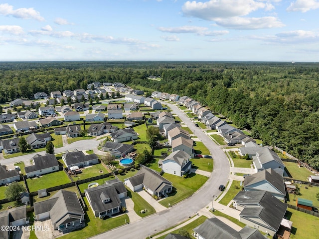 aerial view featuring a residential view and a view of trees