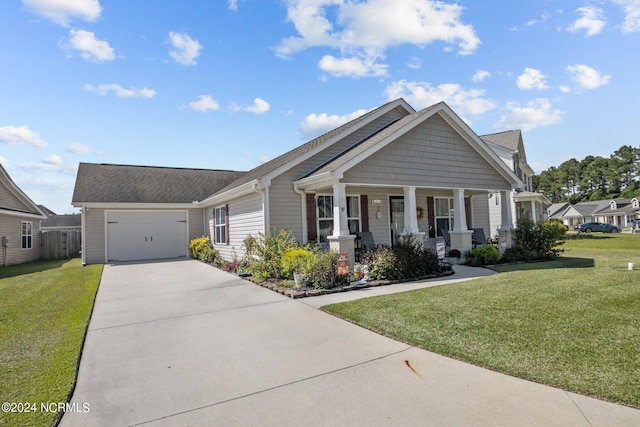 craftsman-style home with a garage, concrete driveway, a porch, and a front yard