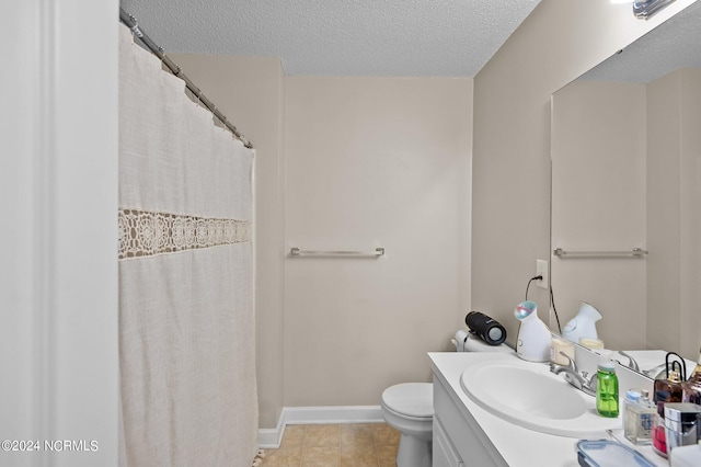 bathroom featuring vanity, a textured ceiling, walk in shower, toilet, and tile patterned floors