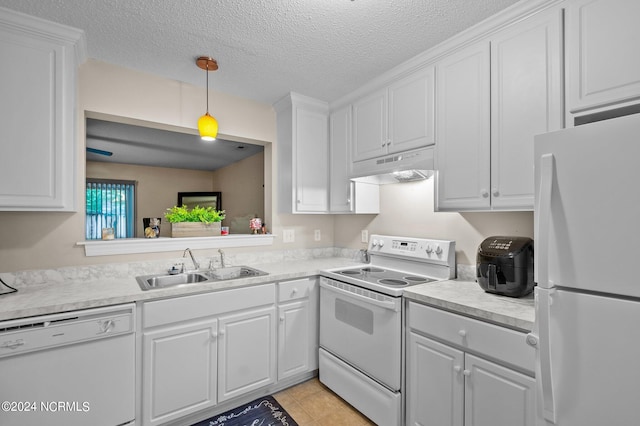 kitchen with white appliances, a textured ceiling, white cabinetry, and hanging light fixtures