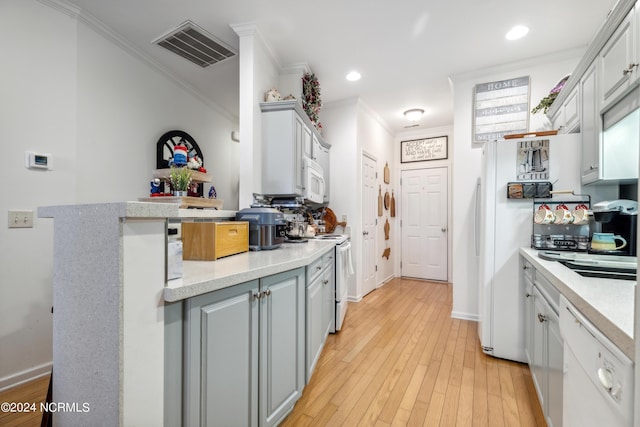 kitchen featuring gray cabinets, crown molding, white appliances, and light hardwood / wood-style floors