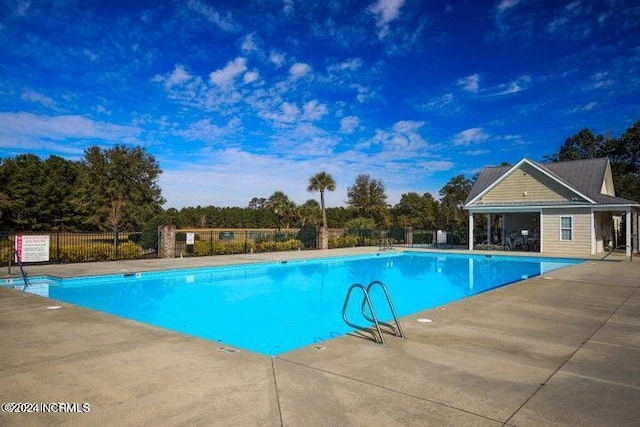 view of swimming pool featuring a patio