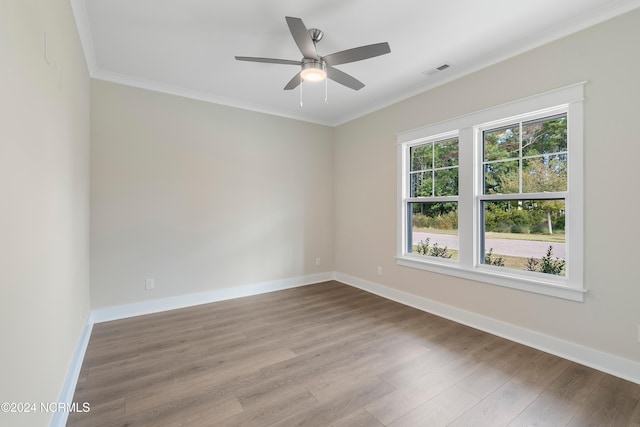 unfurnished room with ceiling fan, crown molding, and light hardwood / wood-style flooring