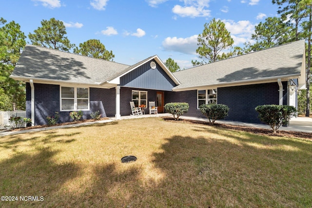 ranch-style home with a front lawn