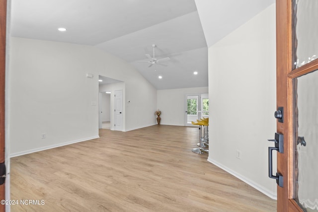 interior space with light hardwood / wood-style flooring, ceiling fan, and vaulted ceiling