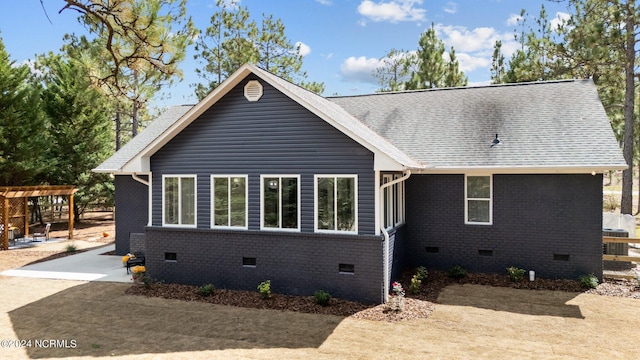 view of front of home with a patio and a pergola