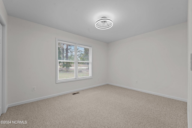 spare room featuring carpet flooring