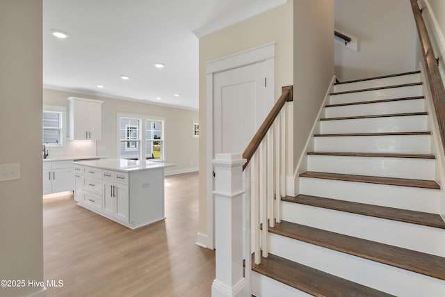 1645 Old Salt Run SW Unit L-46, Shallotte, NC 28470 - stairs with ornamental molding, wood finished floors, recessed lighting, and baseboards