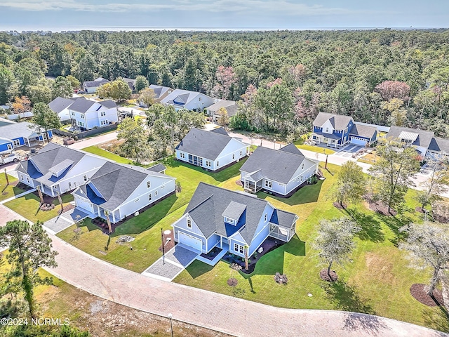 birds eye view of property featuring a residential view and a forest view