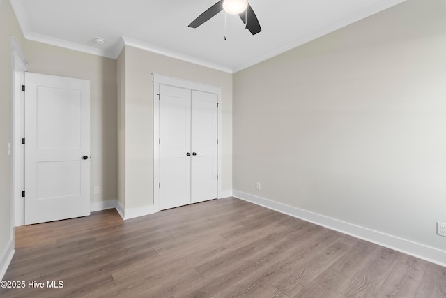 1645 Old Salt Run SW Unit L-46, Shallotte, NC 28470 - unfurnished bedroom featuring ornamental molding, wood finished floors, baseboards, a closet, and ceiling fan