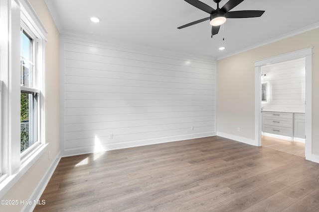 1645 Old Salt Run SW Unit L-46, Shallotte, NC 28470 - unfurnished bedroom featuring crown molding, wood finished floors, recessed lighting, baseboards, and connected bathroom