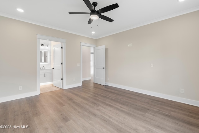 1645 Old Salt Run SW Unit L-46, Shallotte, NC 28470 - unfurnished bedroom featuring ornamental molding, light wood finished floors, baseboards, recessed lighting, and connected bathroom