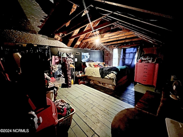 bedroom featuring vaulted ceiling and hardwood / wood-style floors