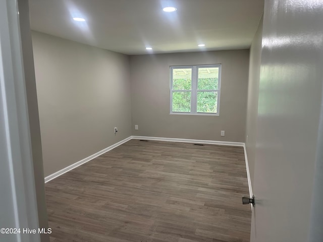 empty room featuring wood-type flooring