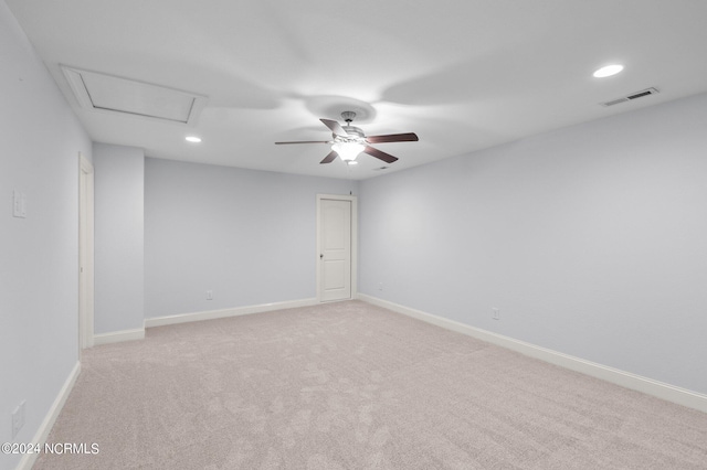 unfurnished room with ceiling fan and light carpet