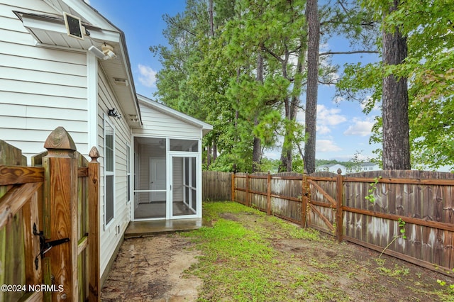 view of yard featuring a sunroom