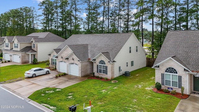 view of front of property featuring cooling unit and a front lawn