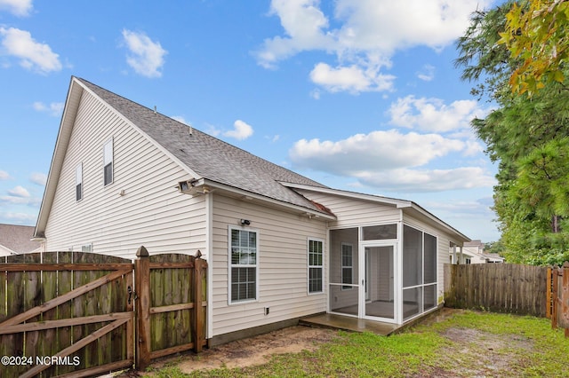 back of house with a sunroom