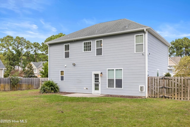 back of property featuring a patio and a lawn