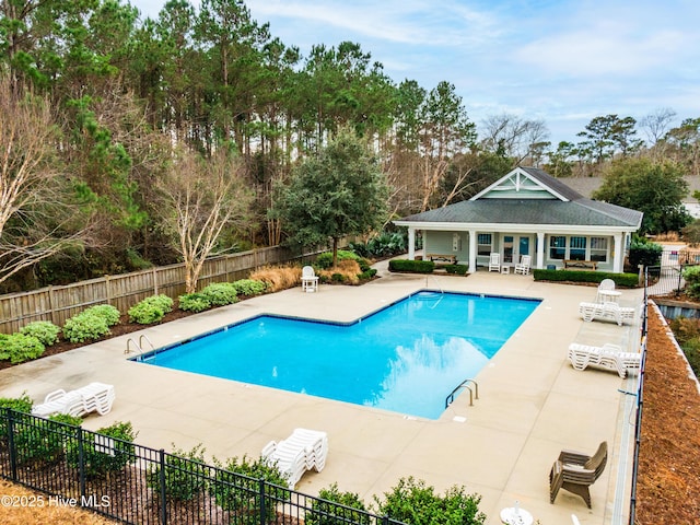 view of swimming pool featuring a patio area