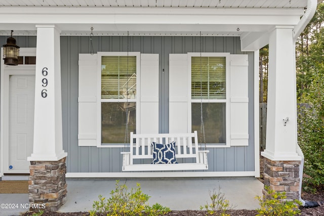 doorway to property with a porch