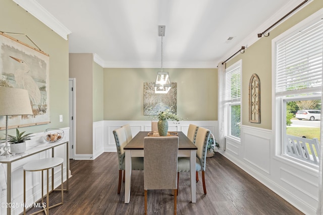 dining space featuring dark hardwood / wood-style flooring and ornamental molding