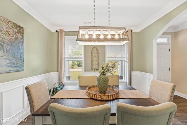 dining room with dark hardwood / wood-style floors and ornamental molding