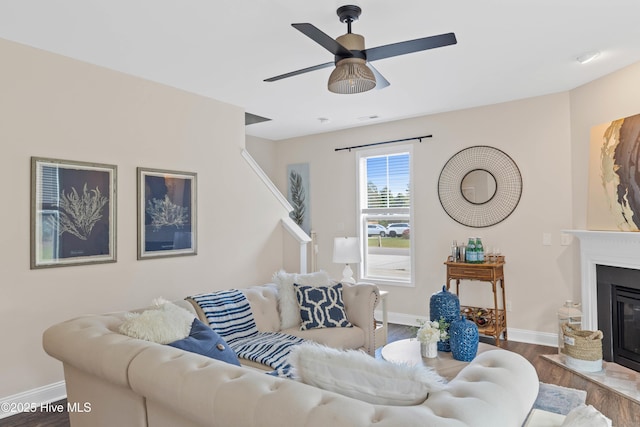 living room with ceiling fan and wood-type flooring