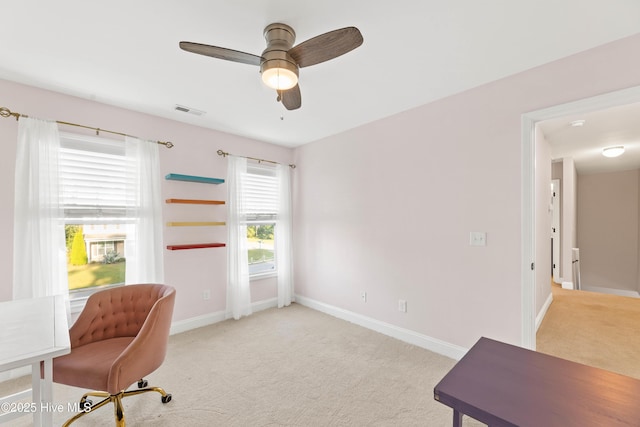 office area featuring ceiling fan and light colored carpet