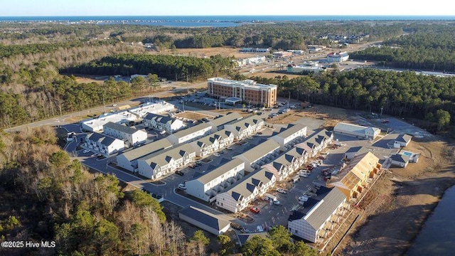 birds eye view of property featuring a wooded view