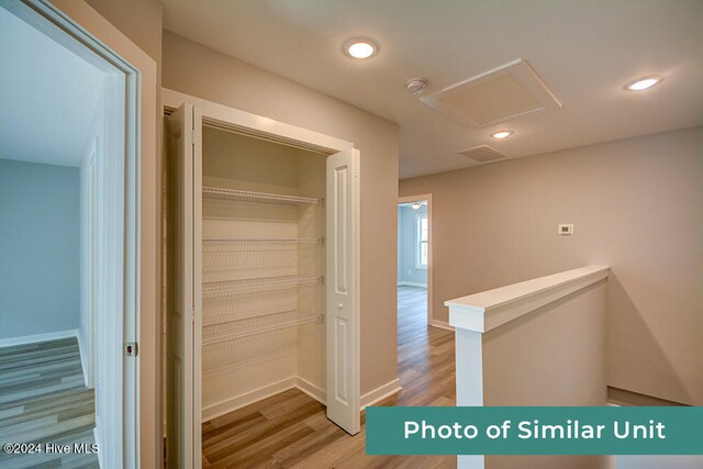 unfurnished room with ceiling fan and light hardwood / wood-style floors