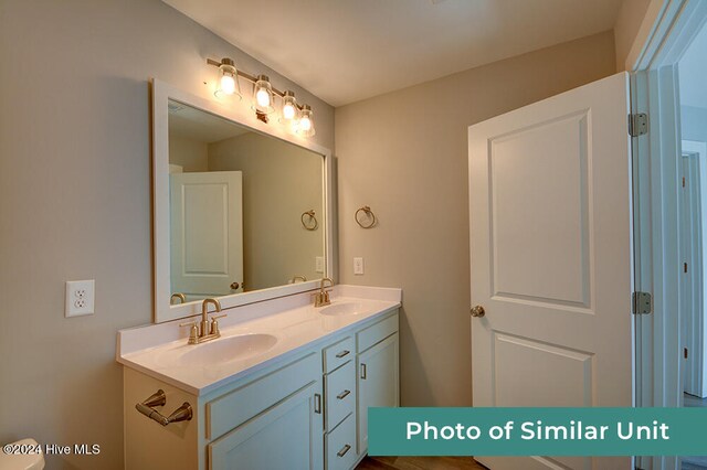 full bathroom with vanity, toilet, wood-type flooring, and bathtub / shower combination