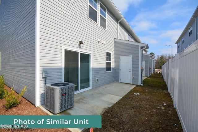 back of property with a patio, fence, and central air condition unit