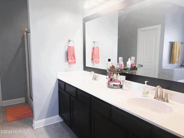 bathroom featuring vanity, tile patterned flooring, and an enclosed shower