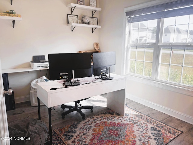 office with dark hardwood / wood-style flooring