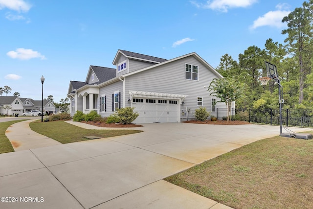 view of property featuring a front yard and a garage